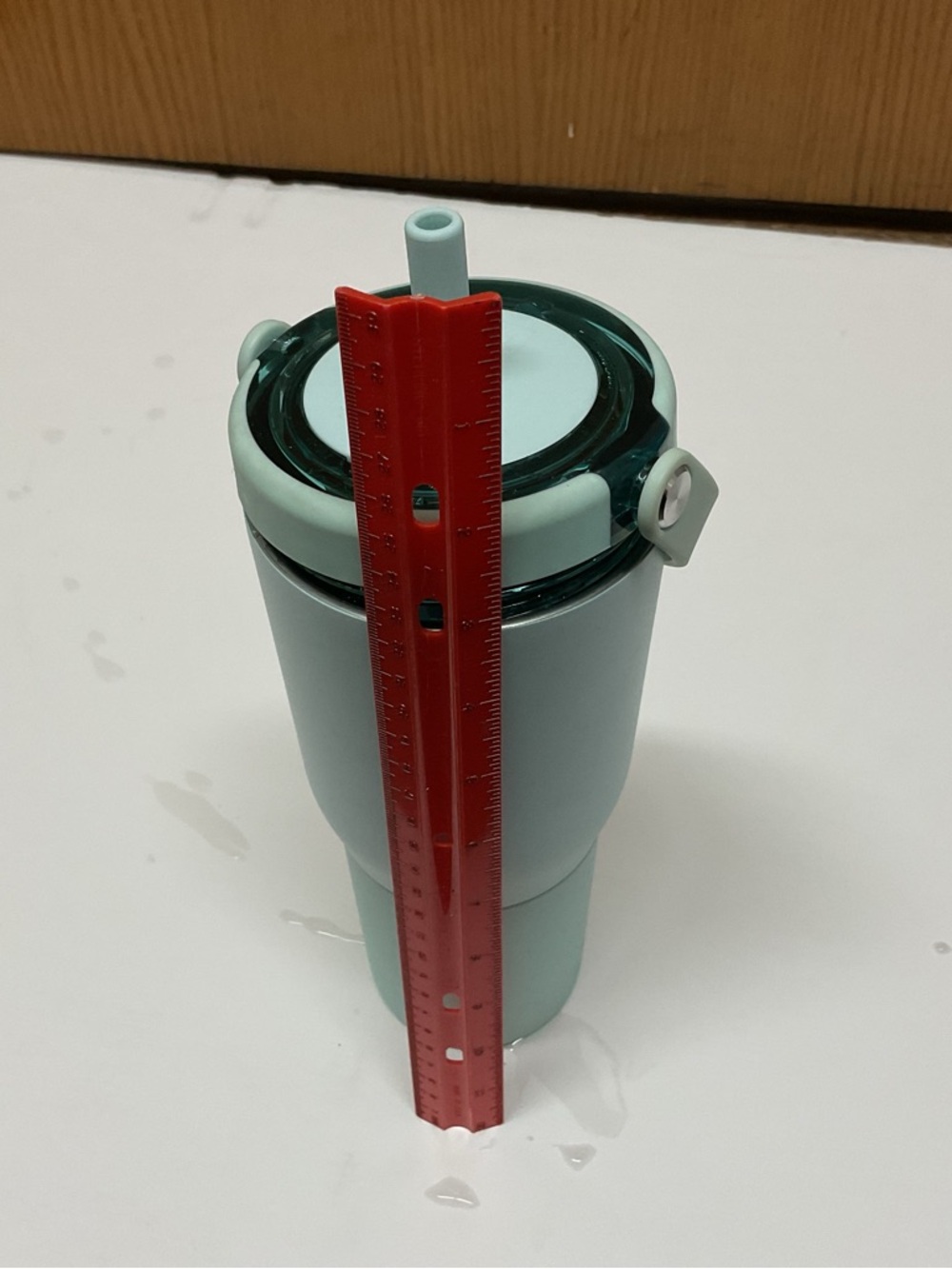 Brumate 35 ounce mint colored traveling mug with straw - Picture 2 of 5